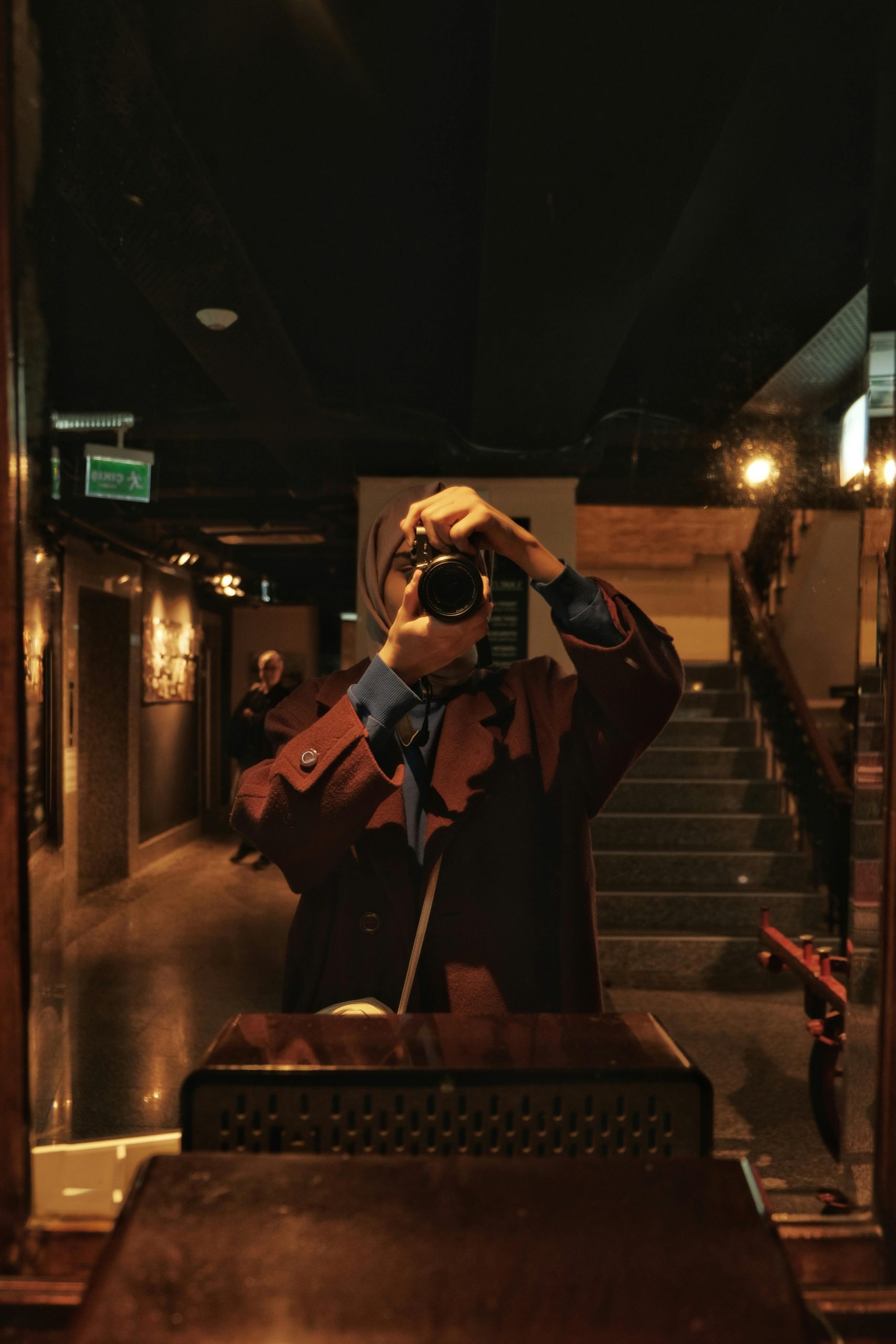 Stylish mirror selfie showcasing elegant fashion in a luxurious indoor setting.